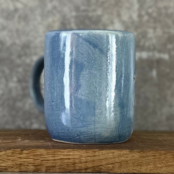 Blue bigger mug with funny phrase in Lithuanian