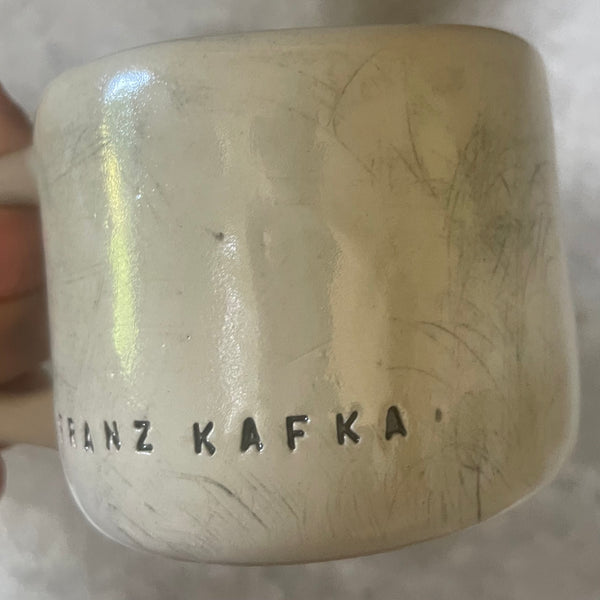 Ceramic coffee mug with quote by Kafka