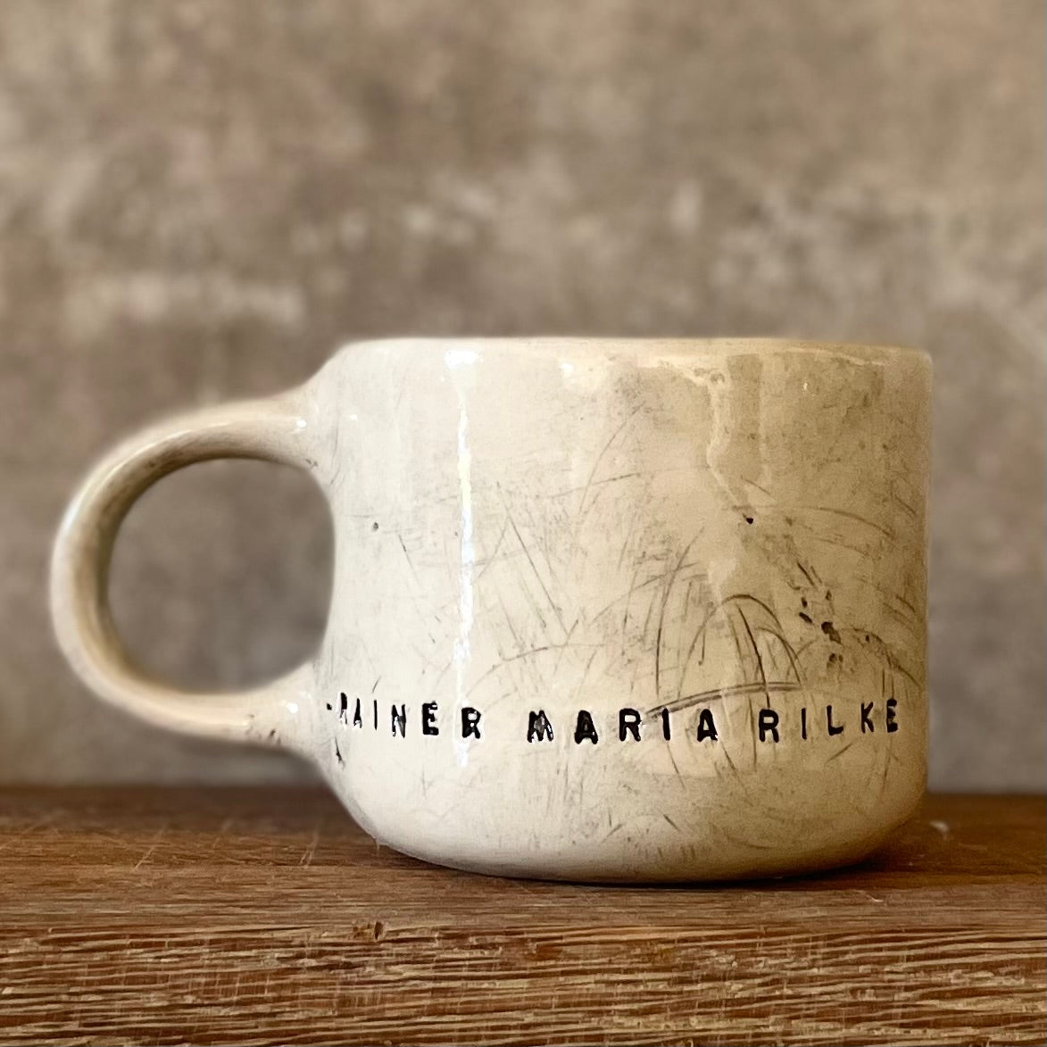 Ceramic mug with artist quote