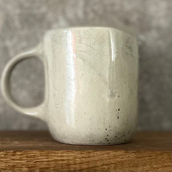 Speckled coffee mug with funny saying in Lithuanian