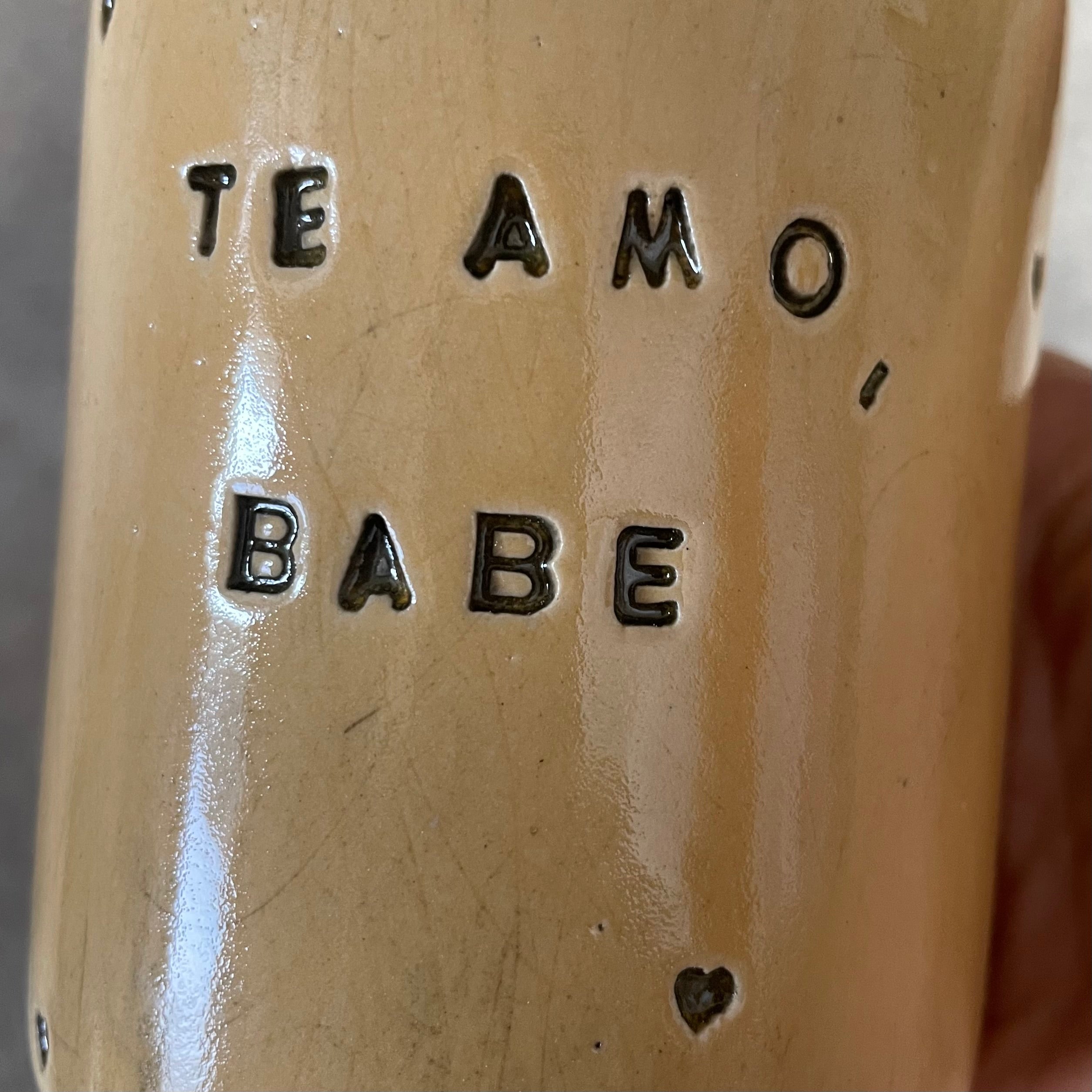 Yellow mug with saying in Spanish