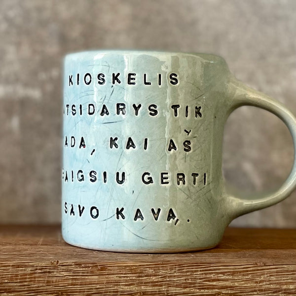 Blue mug with funny phrase in Lithuanian