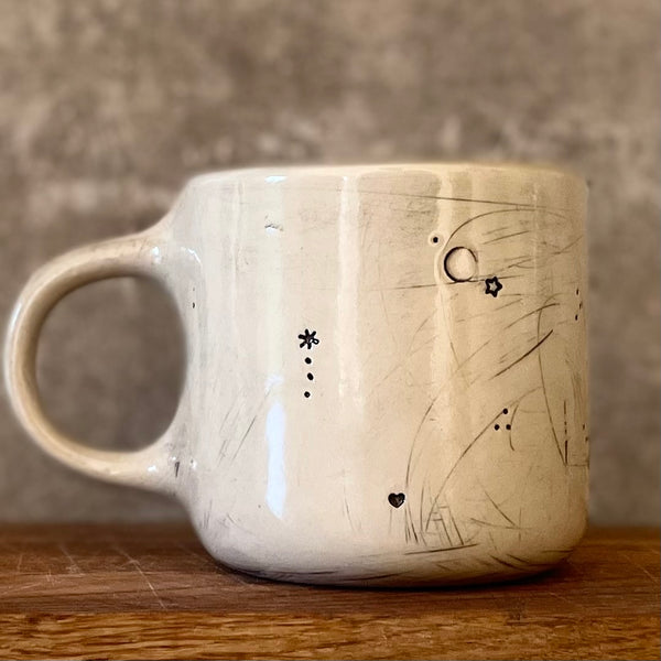 Ceramic mug with saying about magic