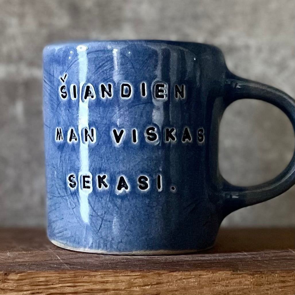 Blue ceramic mug about luck