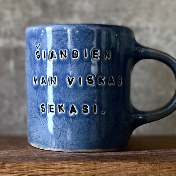Blue ceramic mug about luck