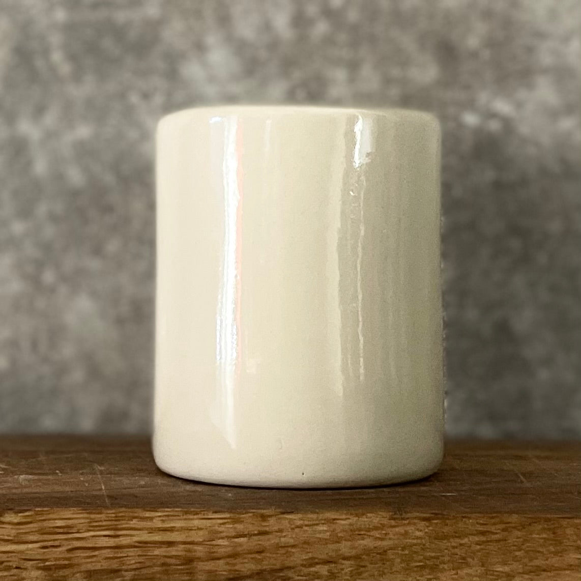 White mug without handle with saying about work