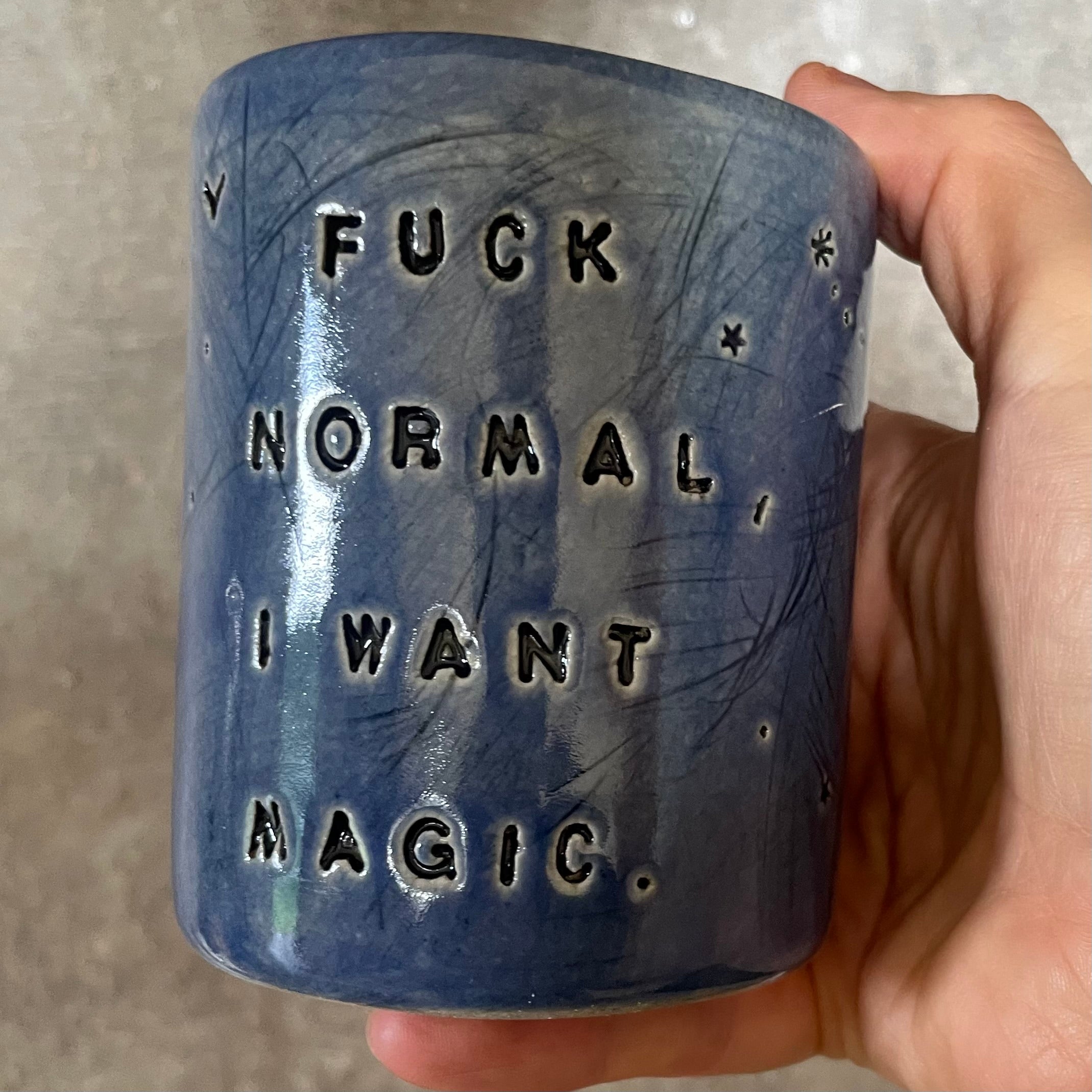 Deep blue mug with magic saying