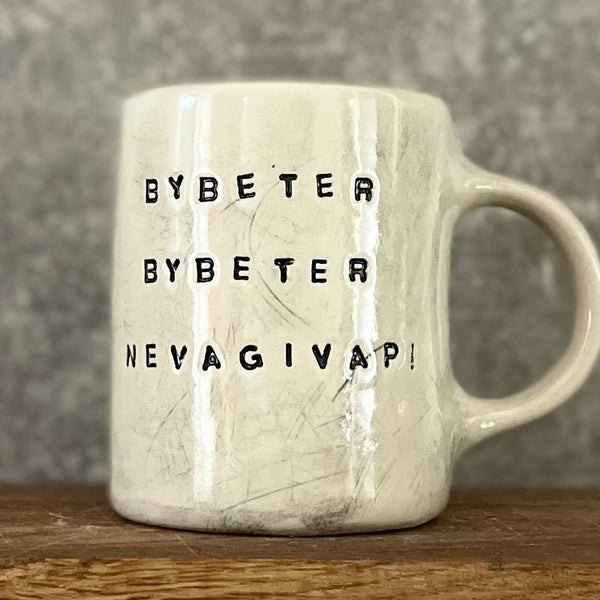 White mug with motivational saying