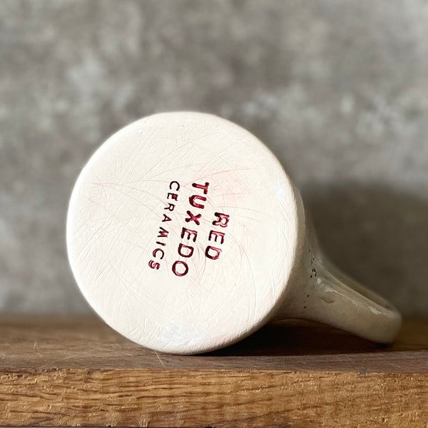 Speckled gray mug about music