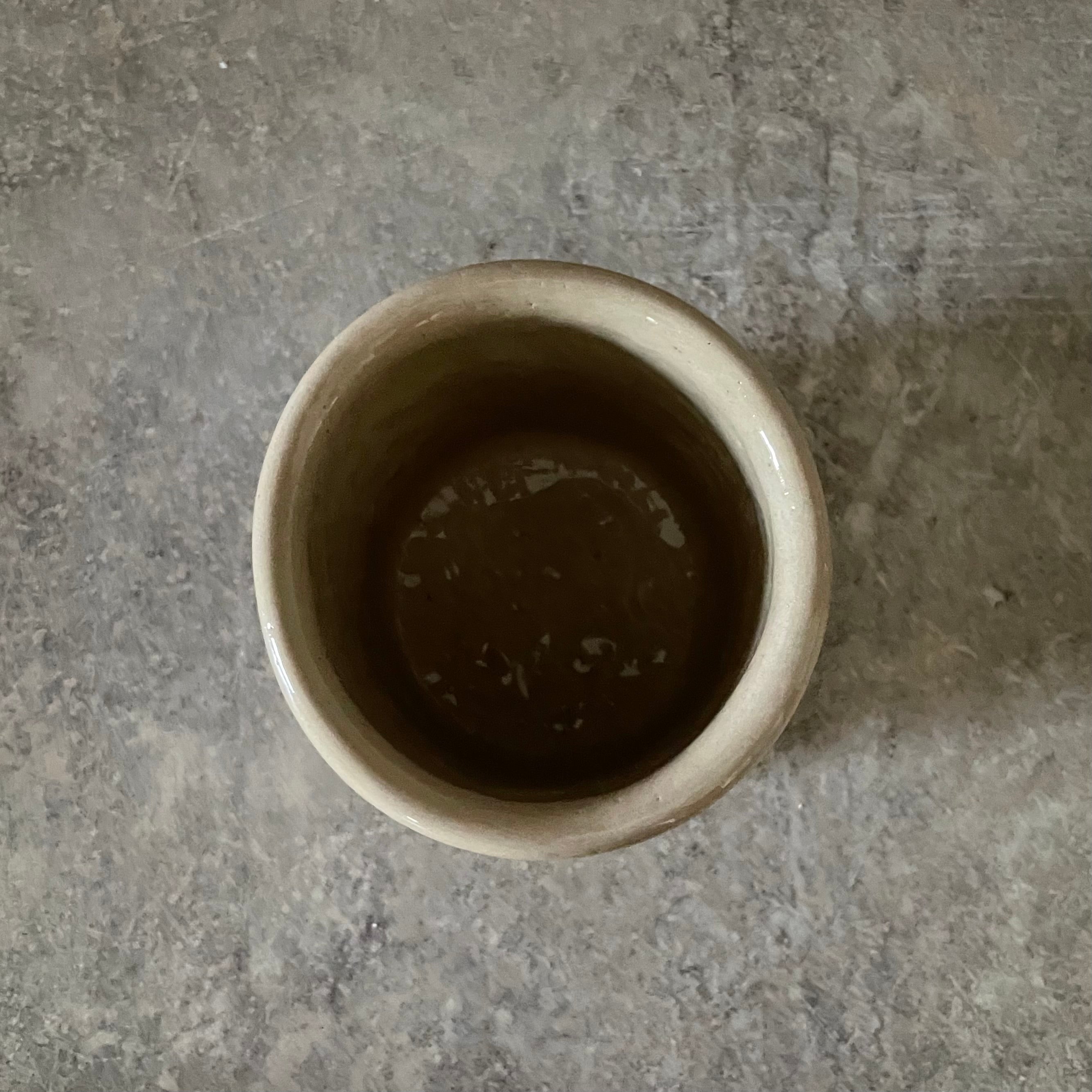 Beige tumbler mug with word RAMYBE