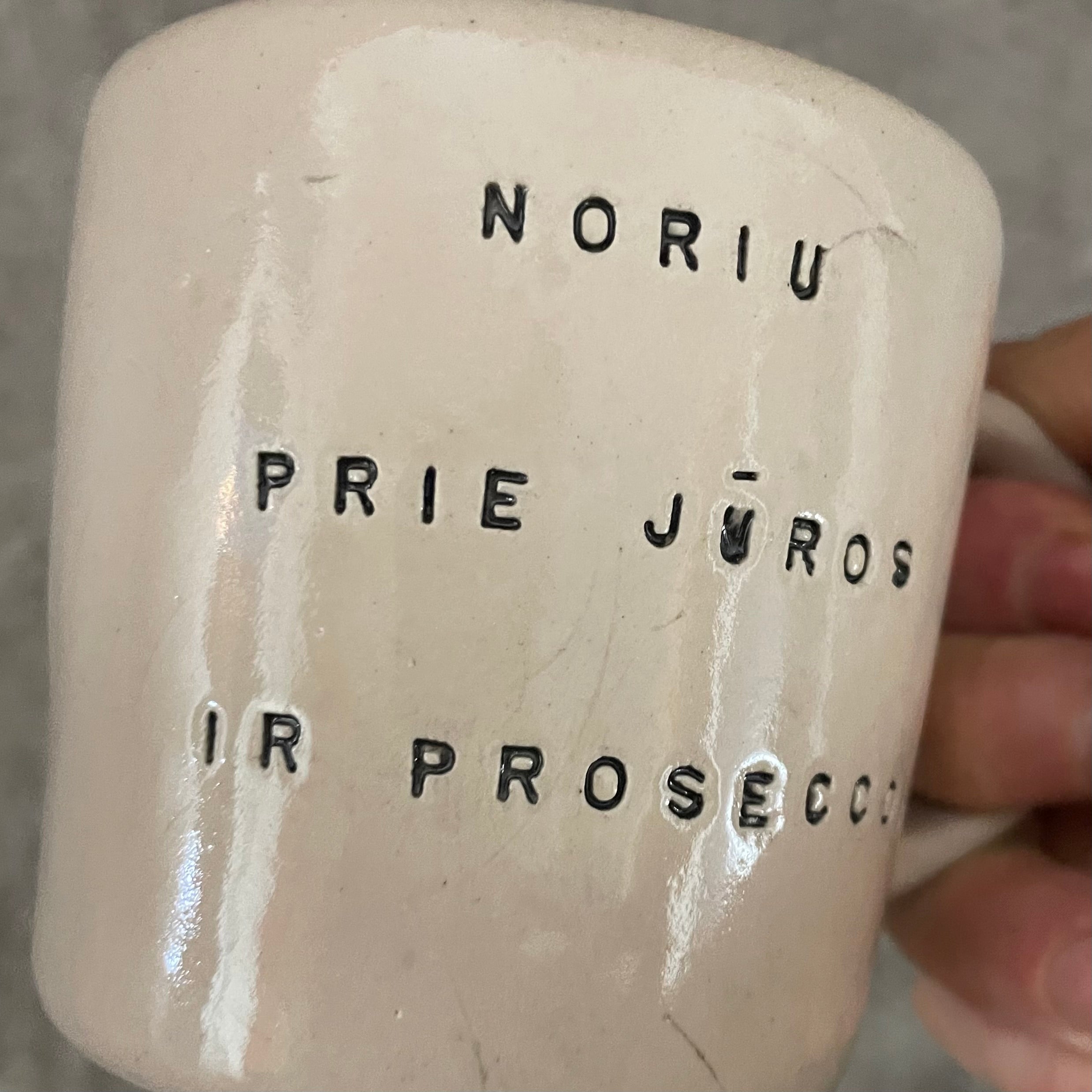 Pale pink mug with prosecco saying