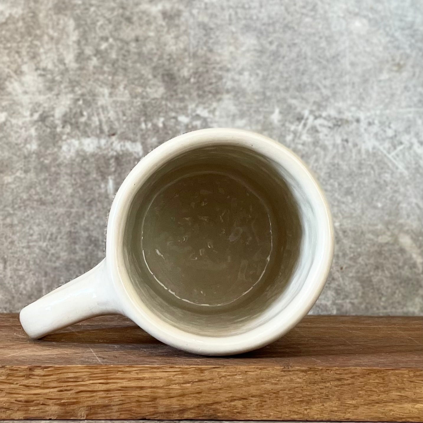 Ceramic mug with saying about balance with handle