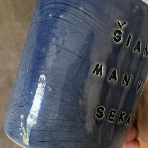Blue ceramic mug about luck