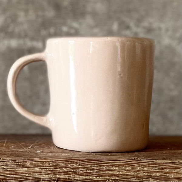 Pale pink mug with prosecco saying