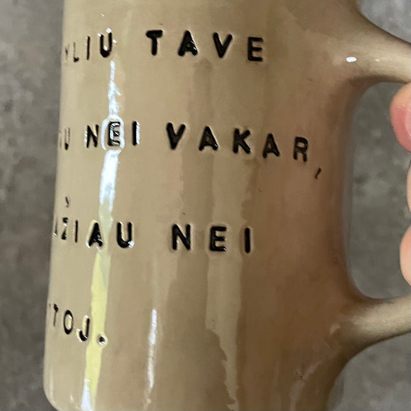 Beige mug with love saying in Lithuanian