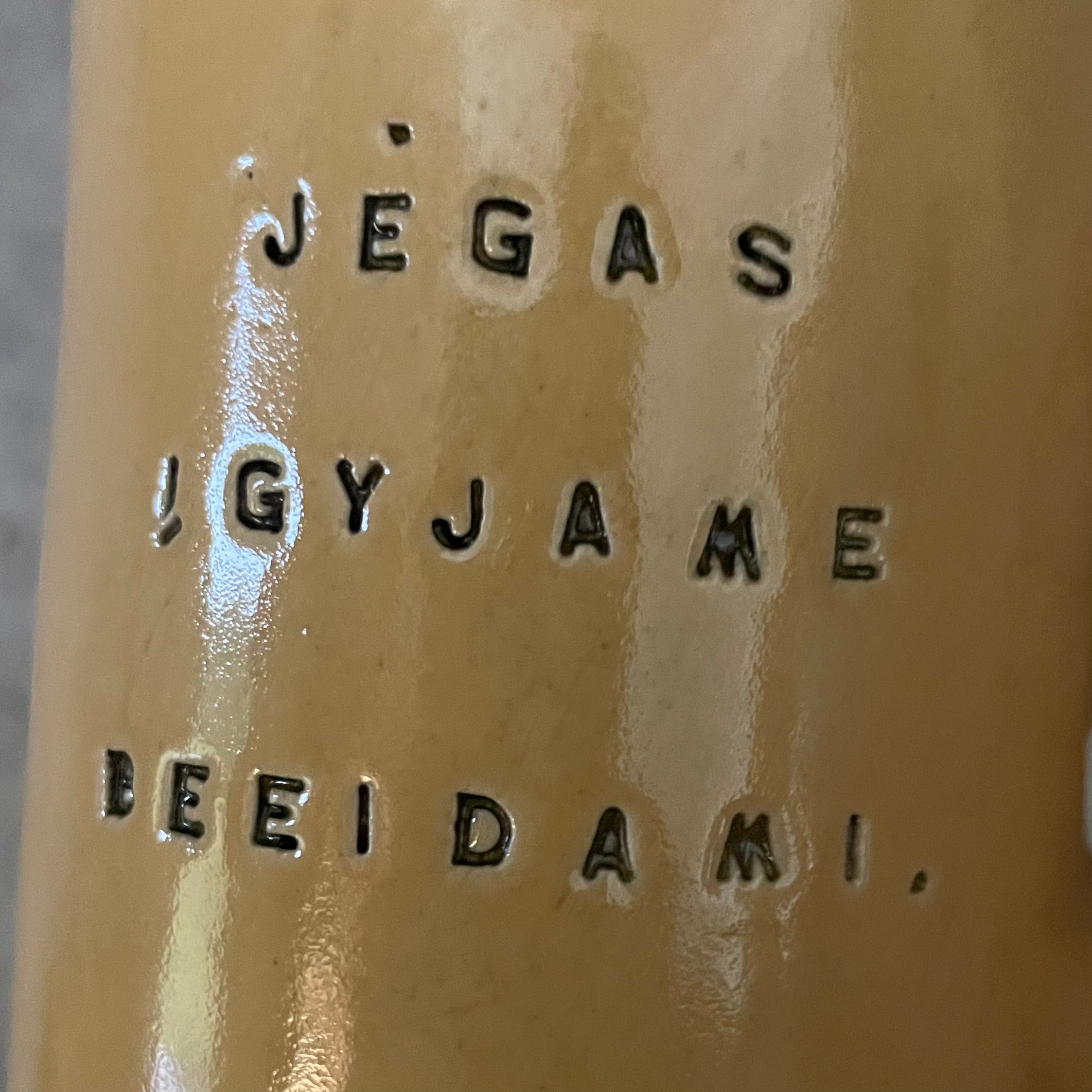 Yellow ceramic mug with quote by Vergil