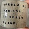 A set of small mugs with words in Lithuanian