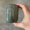 Set of small grayish mugs