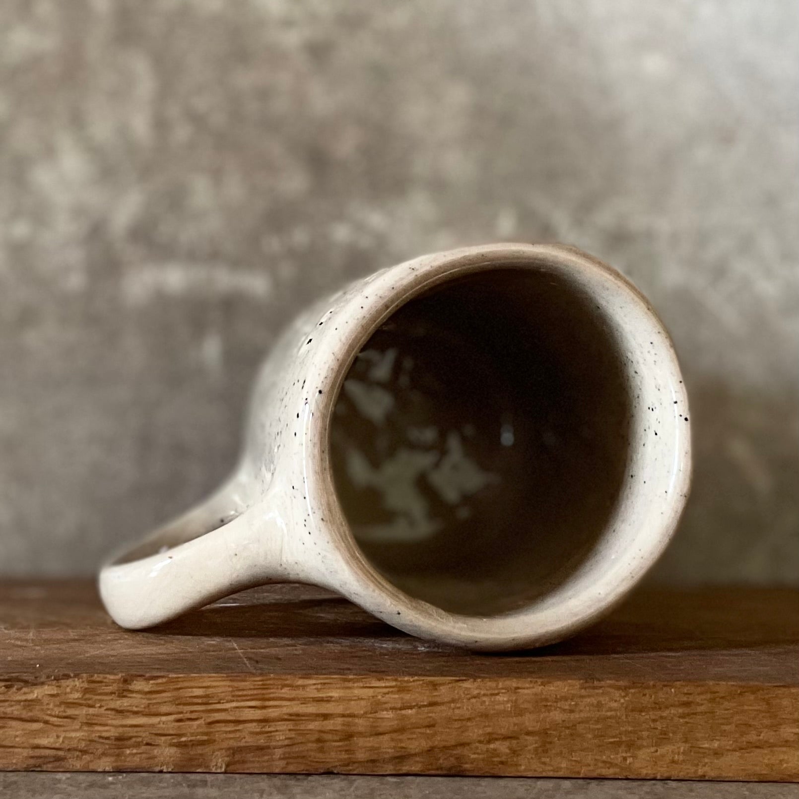 Speckled mug with words about work - another