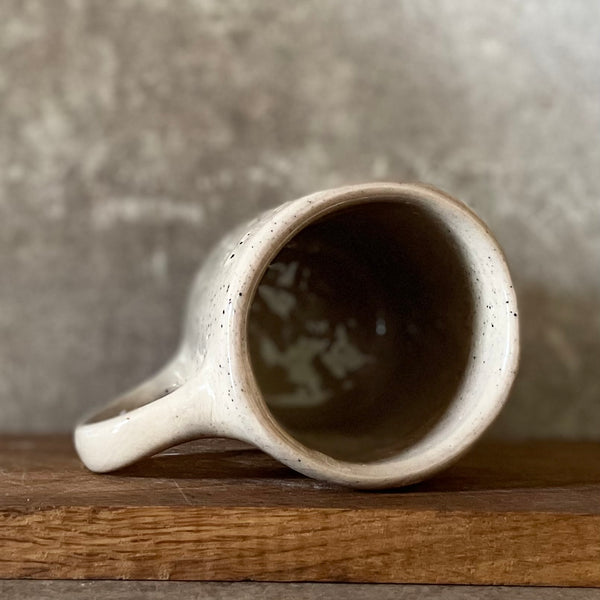 Speckled mug with words about work - another