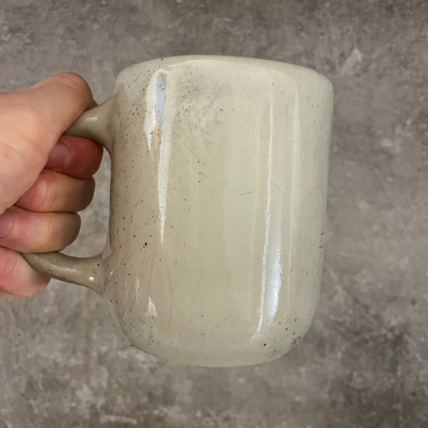 Speckled mug with words about work