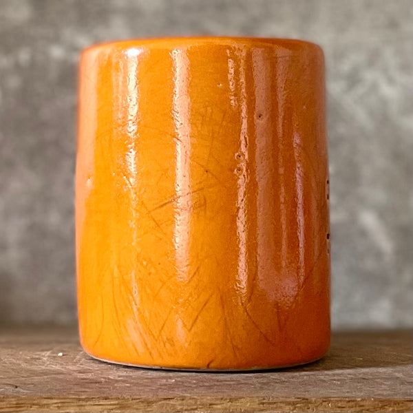 Bright orange tumbler mug