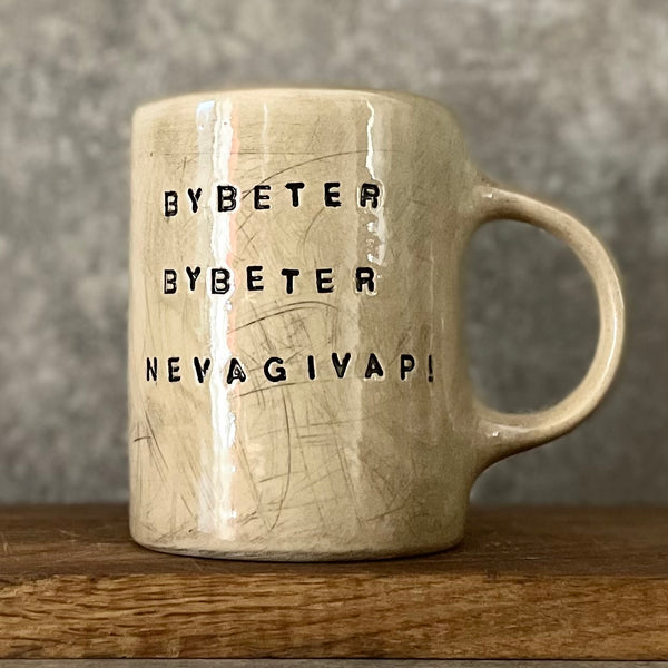 Beige mug with motivational saying