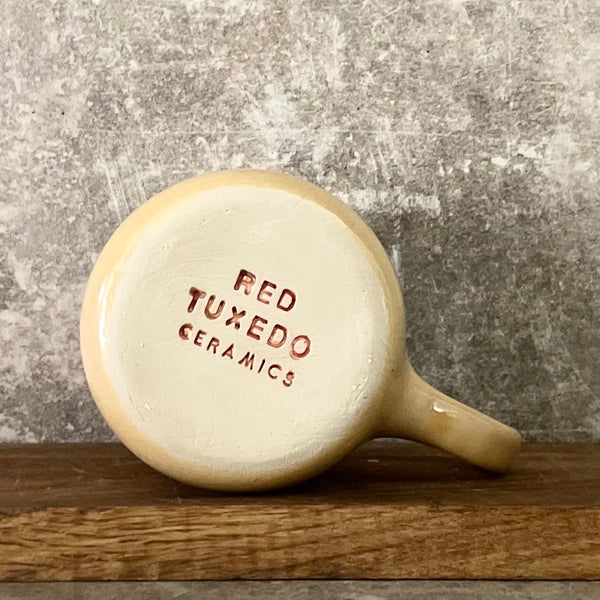 Yellow ceramic mug about luck