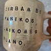 Ceramic mug with words about work