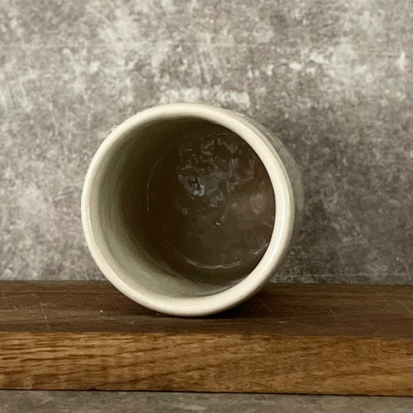 White mug without handle with saying about work