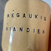 A pair of mugs with words in Lithuanian