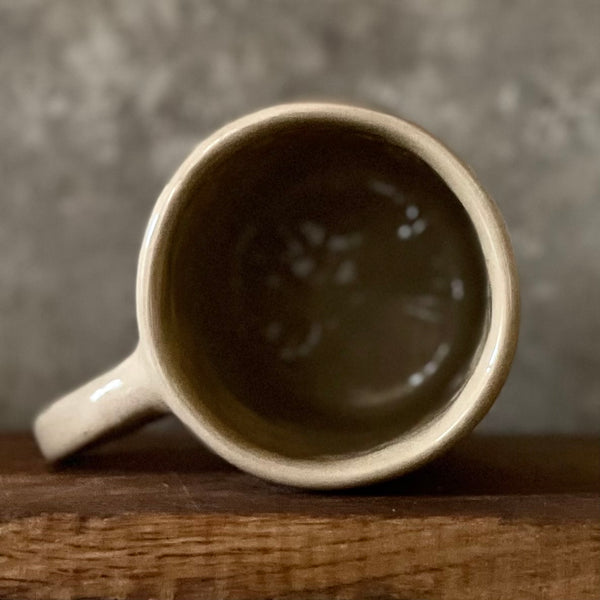 Beige mug with quote by Confucius