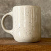 Speckled mug with saying in Lithuanian
