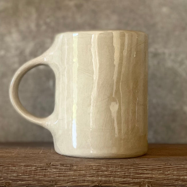 Cozy greenish mug with saying in Lithuanian