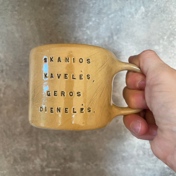 Yellow mug with good wishes