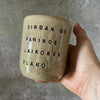 Beige tumbler mug with saying about work