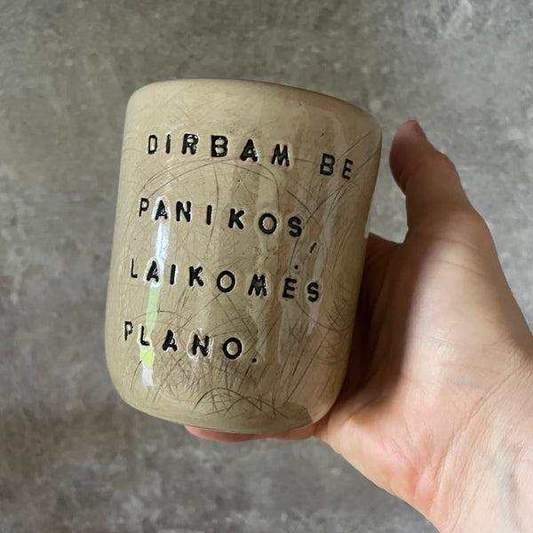 Beige tumbler mug with saying about work
