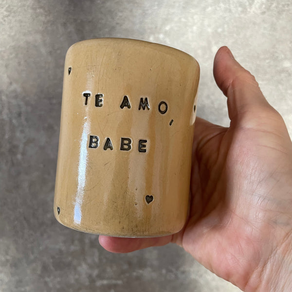 Yellow mug with saying in Spanish