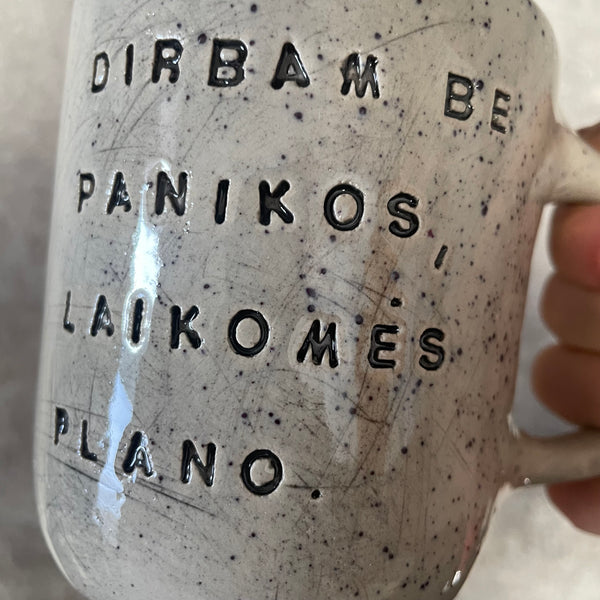 Speckled mug with words about work - another