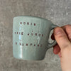 Small blue mug with words in Lithuanian