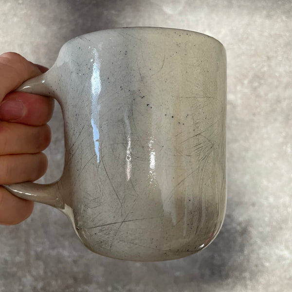 Speckled mug with words about work - another
