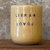 Geltonas puodelis "LIEKAM LOVOJ" 150 ml