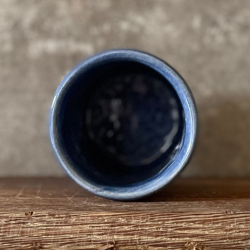 Deep blue mug with magic saying
