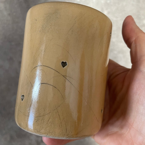 Yellow mug with saying in Spanish