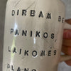 Two big ceramic mugs with words about work