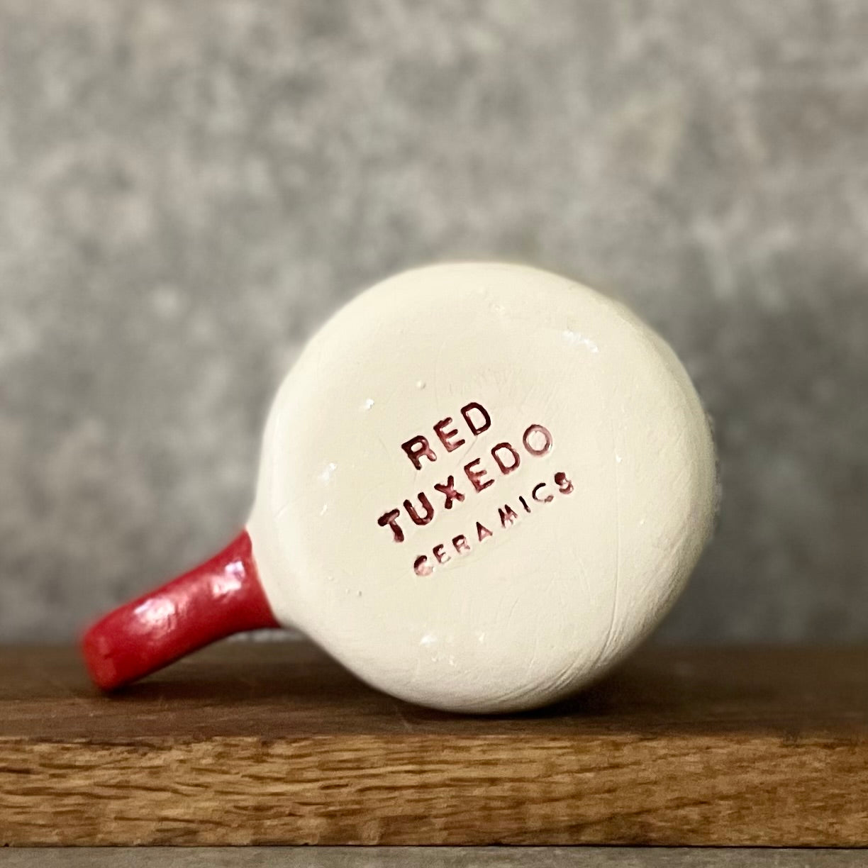 Puodelis su užrašu