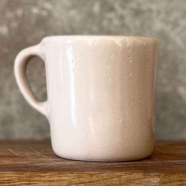 Small pink mug with words in Lithuanian