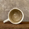 Ceramic mug with artist quote