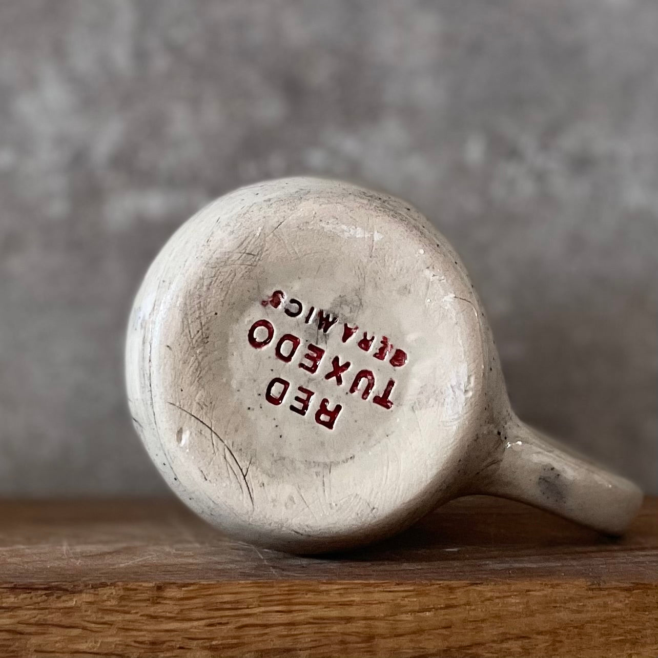 Speckled mug with words about work - another