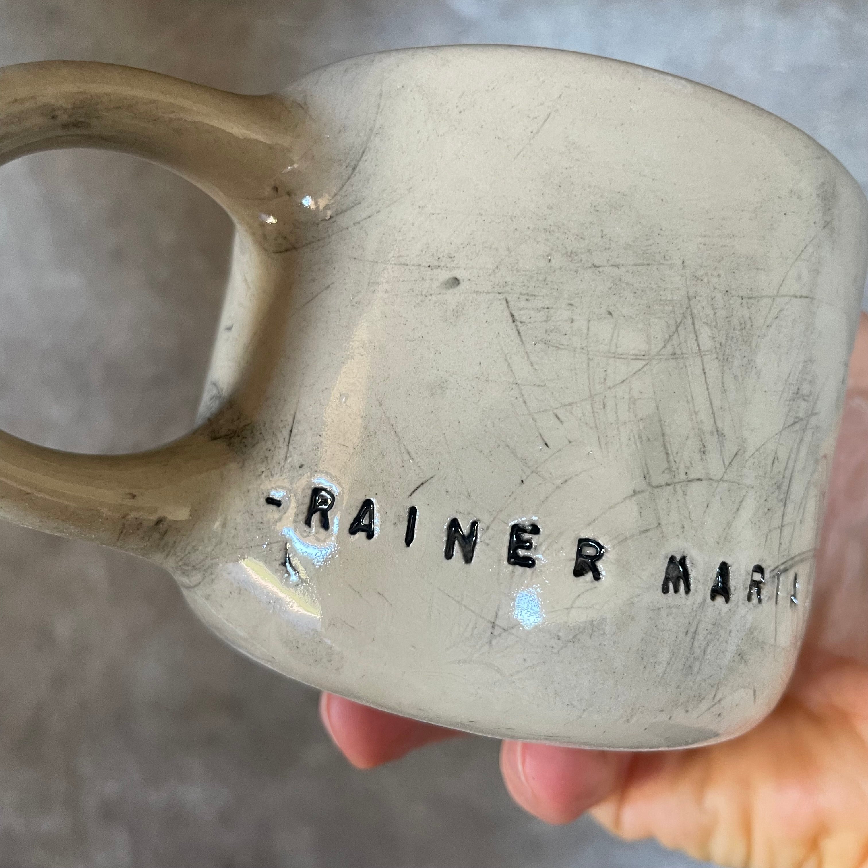 Ceramic mug with artist quote